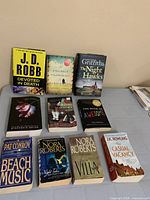 All ten books laid out on table, fronts visible