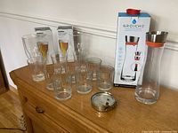 All items including carafe, tumblers, beer glasses, infuser disc