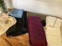 Group view of slips, scarves, handkerchief stacks