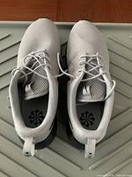 Top view of both shoes showing uppers, laces, insoles