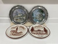 All four plates upright showing front designs
