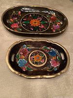 Overview of both Batea trays showing sizes and decoration