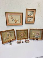 Group shot of all framed prints, cups, saucers and figurines