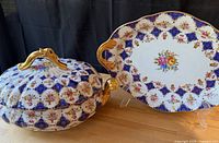 Covered tureen and matching platter showing overall pattern