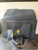 Open briefcase showing interior, shoulder strap, security code lock instructions