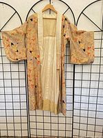 Front view of kimono robe hung open showing lining and exterior pattern