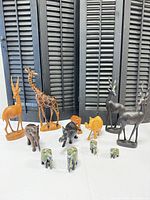 Group shot of all ten wooden safari animal figurines