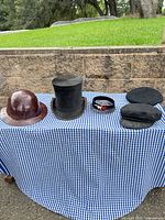 Group shot showing all five hats on table
