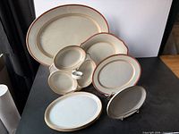 All porcelain serving pieces arranged together