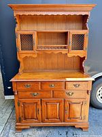 Full view of the two-piece sideboard cabinet showing upper hutch and lower buffet