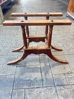 Full view of wooden table base showing overall structure