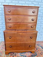 front view showing all five drawers and knobs