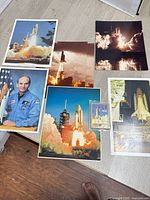 Overview of all six lithographs and sealed card pack