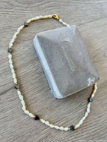 Full view of pearl and heart bead necklace