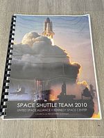 Front cover showing shuttle launch and title