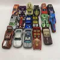 Full group shot of 17 Hot Wheels cars arranged in rows