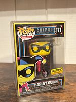 Front view of boxed Harley Quinn #371 figure showing Hot Topic Exclusive sticker