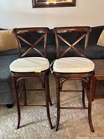 Front view of both x-back bar stools with cushions