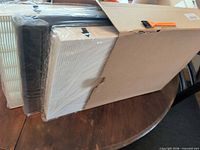 Box opened showing three sealed rectangular filters