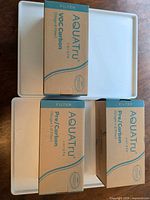 Three AquaTru filter boxes top view