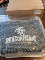 Bubble-wrapped Dragonhawk item and outer shipping box