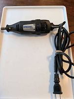 Full view of Dremel 100 rotary tool with attached cord