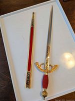 Sword and scabbard full view showing design and length