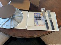 Turntable, spatulas, piping tips set, smoother laid out