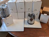 stack of ten boxed heater covers with two units displayed unboxed