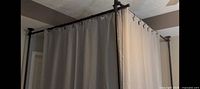 Installed example of Sunally room divider rod with curtains (curtains not included)