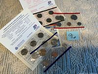 Overall view of both 2001 P & D coin sets in original plastic sleeves with insert cards