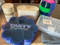 Group view of all containers and dish towel