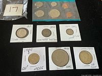 Overview showing all coins: 1972 mint set, six individual coins in flips