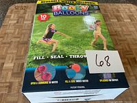 Front of sealed Boogy Balloons retail box