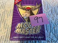 Front view of sealed Moose Master game box with lot tag