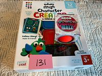 Front of sealed Whea Dough Character Creator kit with Squish Ball on top