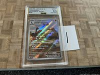 Front view of graded Mudsdale card in slab