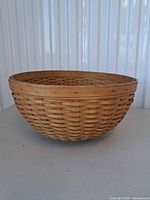Side view of handwoven round basket bowl