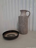 Vase and bowl together for scale and overview
