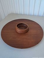 Top view of round teak platter with central bowl