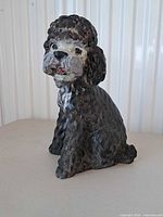 Front view of concrete poodle statue