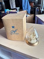 Ornament next to original Avon Gift Collection box