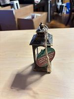 Front view showing lantern structure, tag, hanging loop