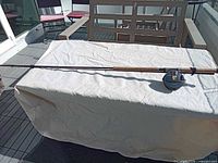 Full view of Shimano Moocher Plus 4000GT rod with reel attached on table
