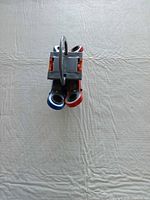 Top view showing red and blue handled wrenches in grey stand