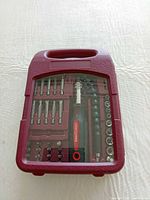 Closed case showing tool set through clear lid