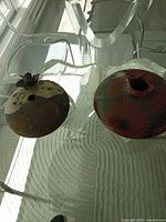 top view showing both pottery pieces, focus on grey/brown vase size and form