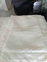 Cream silky sham showing wave texture