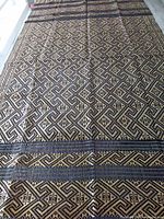 Full view of entire tablecloth spread out showing overall size and pattern