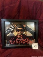 Framed signed photograph showing Bam Margera autograph with date